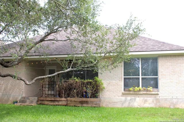 a view of front door of house with yard