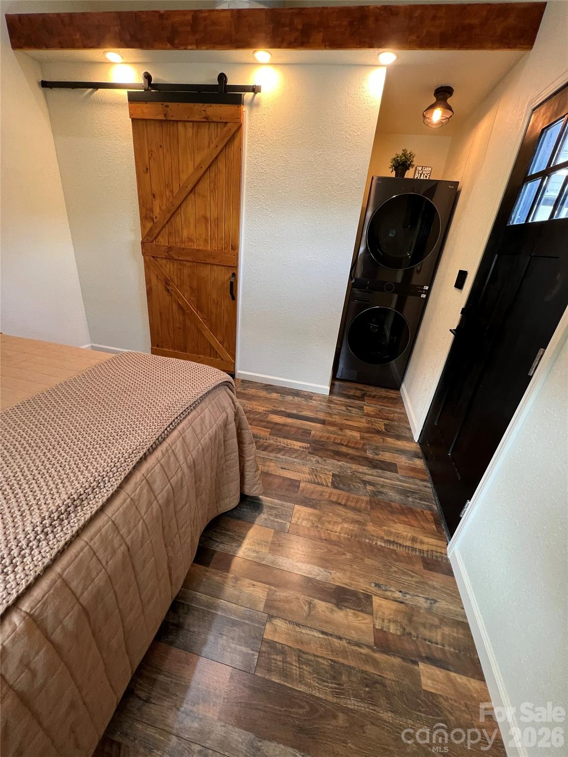 415 Hyde Road, Unit 24 Robbinsville, NC 28771 - Photo 13 of 47 a bedroom with a bed and a walk in closet