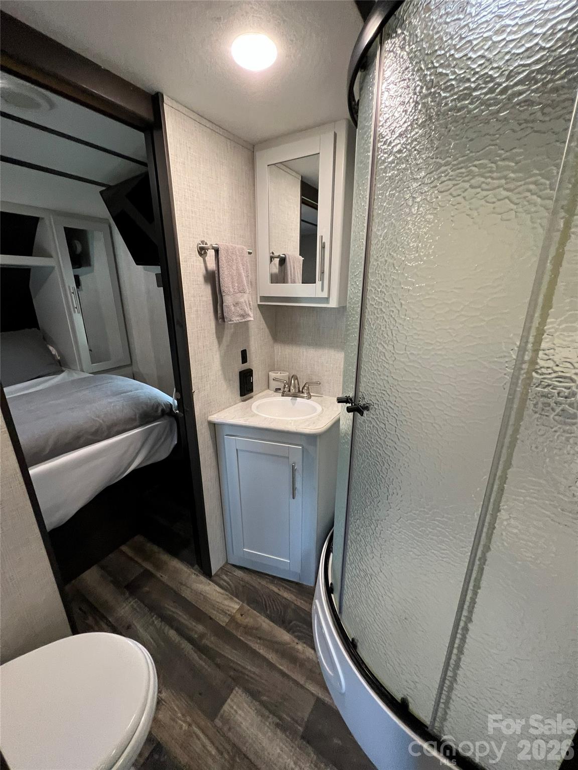 415 Hyde Road, Unit 24 Robbinsville, NC 28771 - Photo 16 of 47 a bathroom with a sink toilet and shower