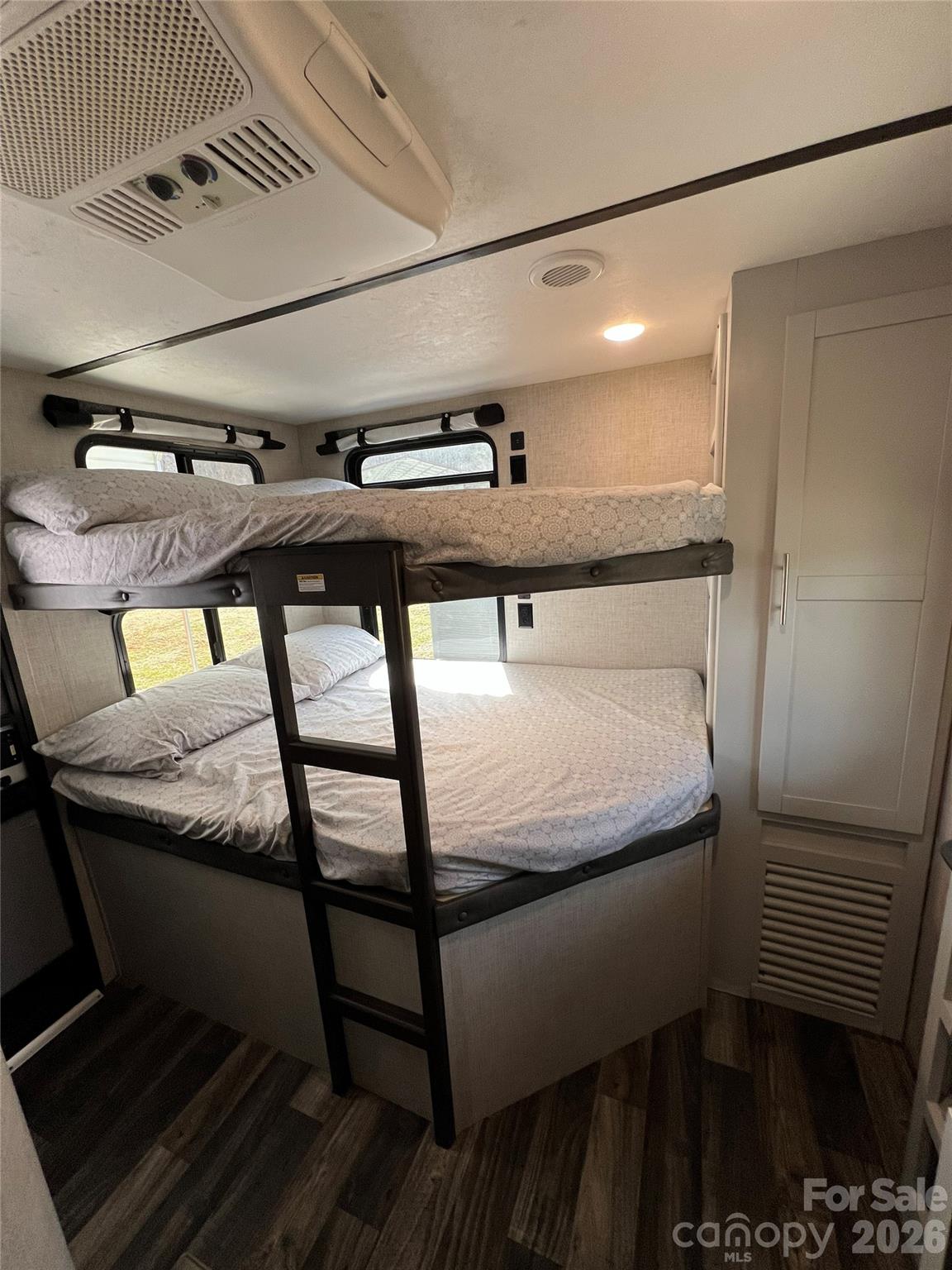 415 Hyde Road, Unit 24 Robbinsville, NC 28771 - Photo 25 of 47 a bathroom with a sink a mirror and window