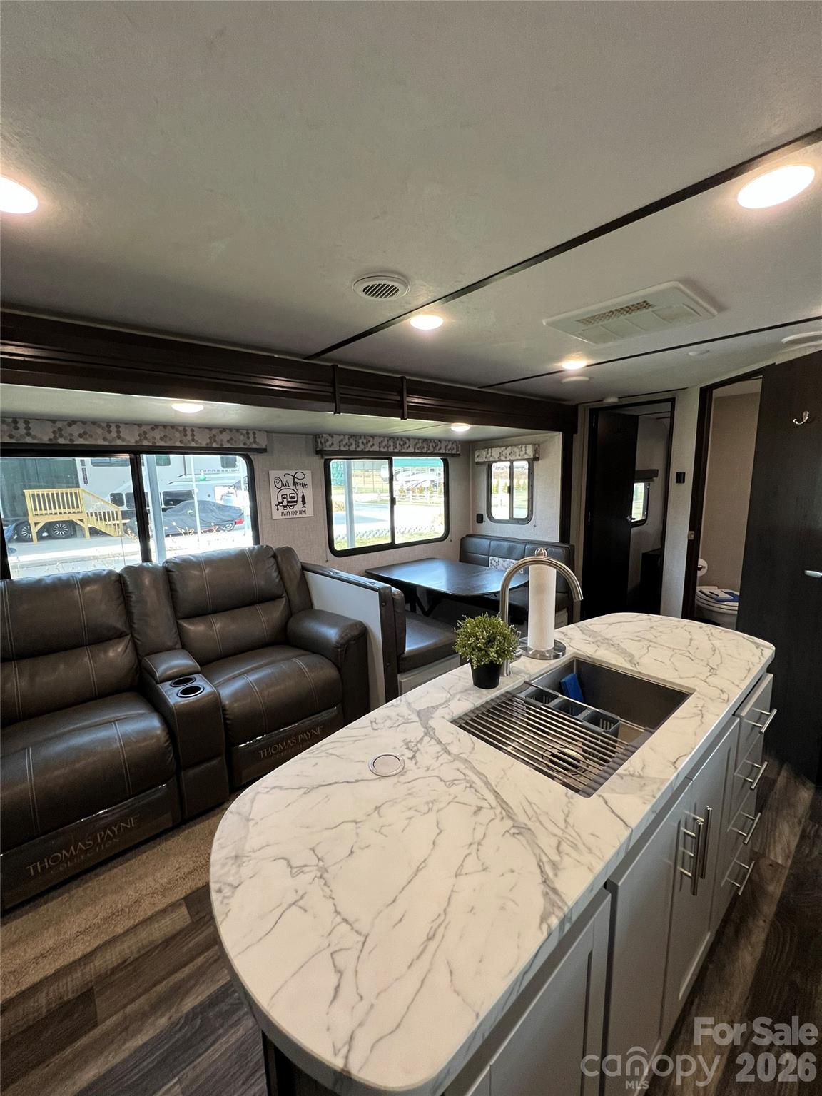 415 Hyde Road, Unit 24 Robbinsville, NC 28771 - Photo 29 of 47 a living room with couches and kitchen view