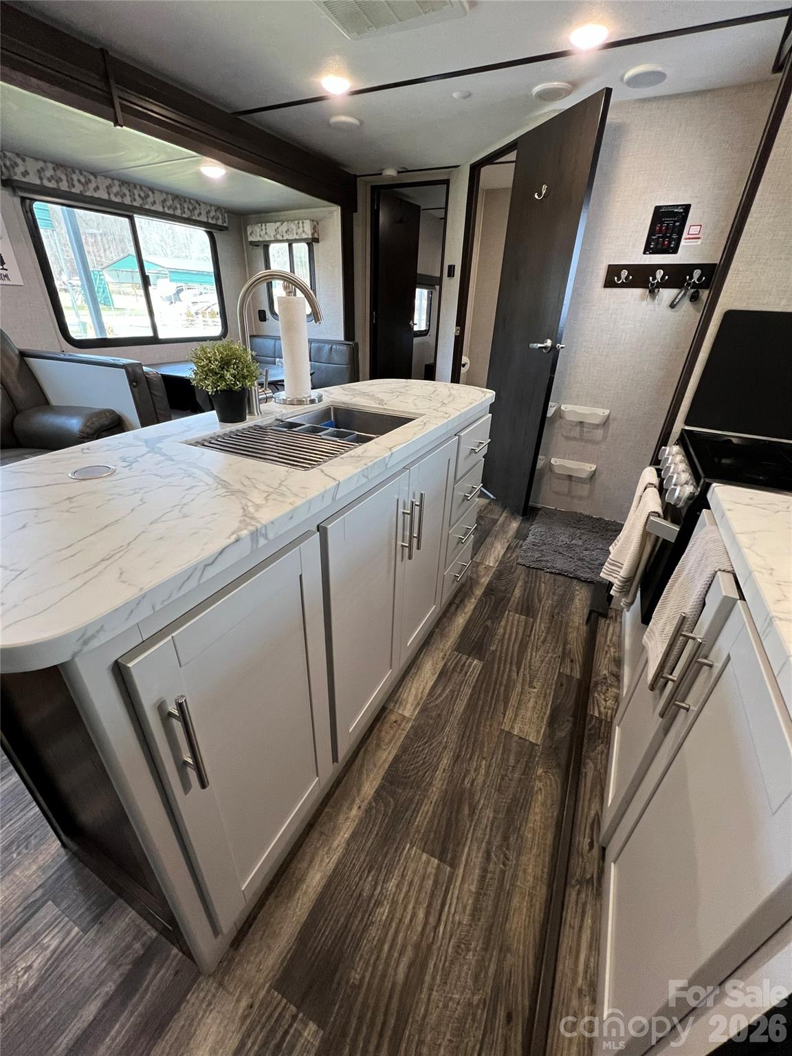 415 Hyde Road, Unit 24 Robbinsville, NC 28771 - Photo 30 of 47 a bathroom with a sink mirror and window