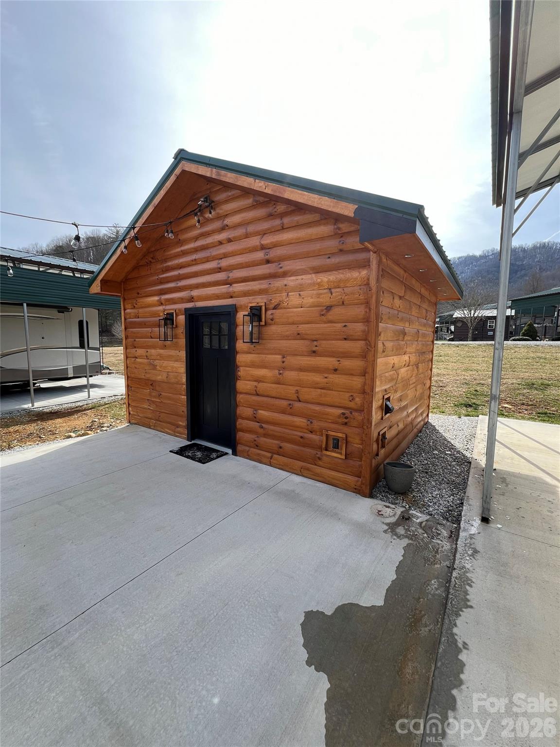 415 Hyde Road, Unit 24 Robbinsville, NC 28771 - Photo 3 of 47 a front view of a house with a garage