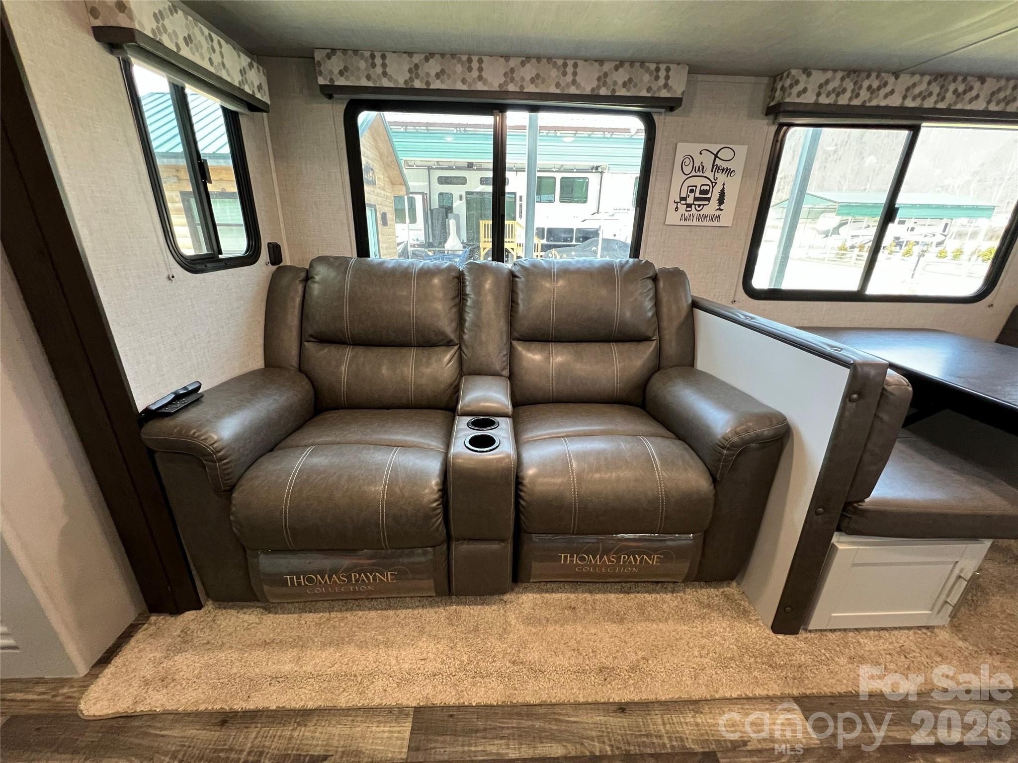 415 Hyde Road, Unit 24 Robbinsville, NC 28771 - Photo 33 of 47 a living room with a couch and a large window