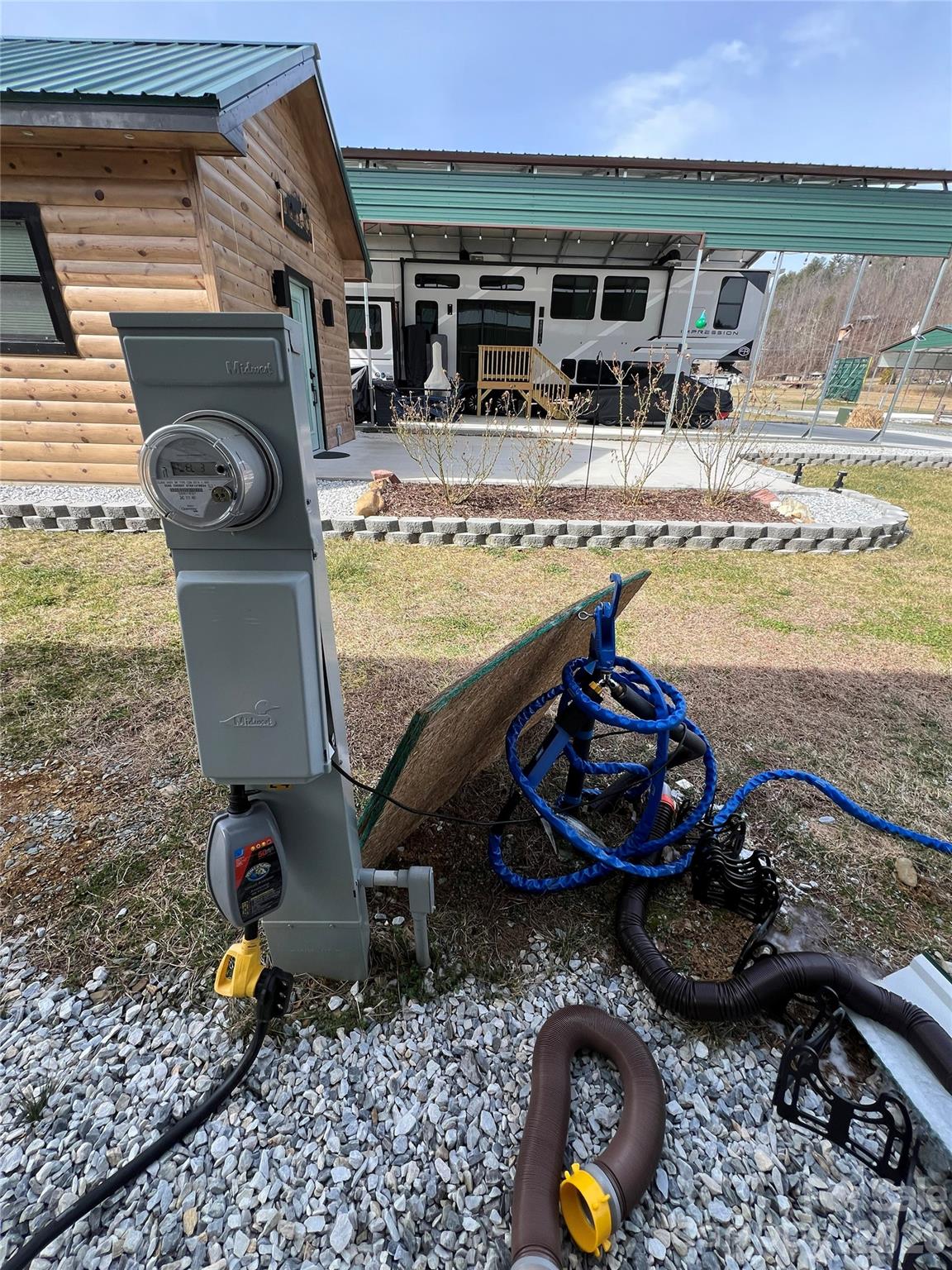 415 Hyde Road, Unit 24 Robbinsville, NC 28771 - Photo 39 of 47 a view of a backyard with table and chairs