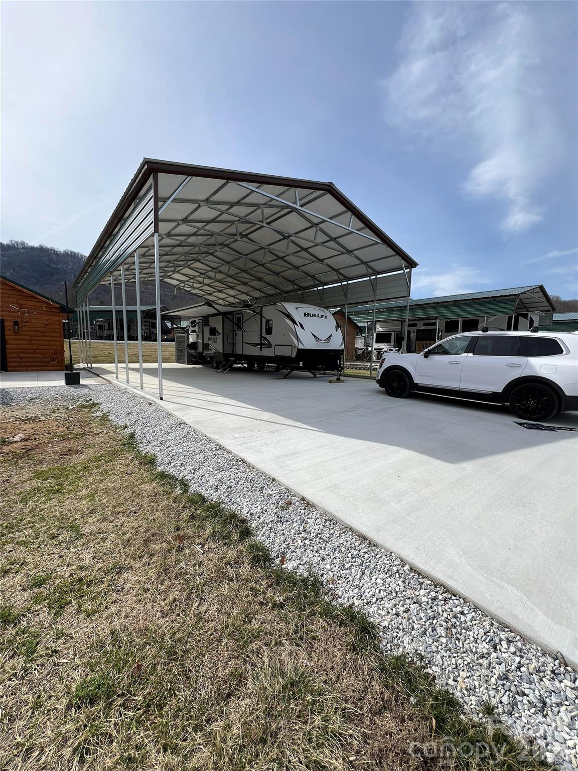 415 Hyde Road, Unit 24 Robbinsville, NC 28771 - Photo 43 of 47 a view of a car park in front of house