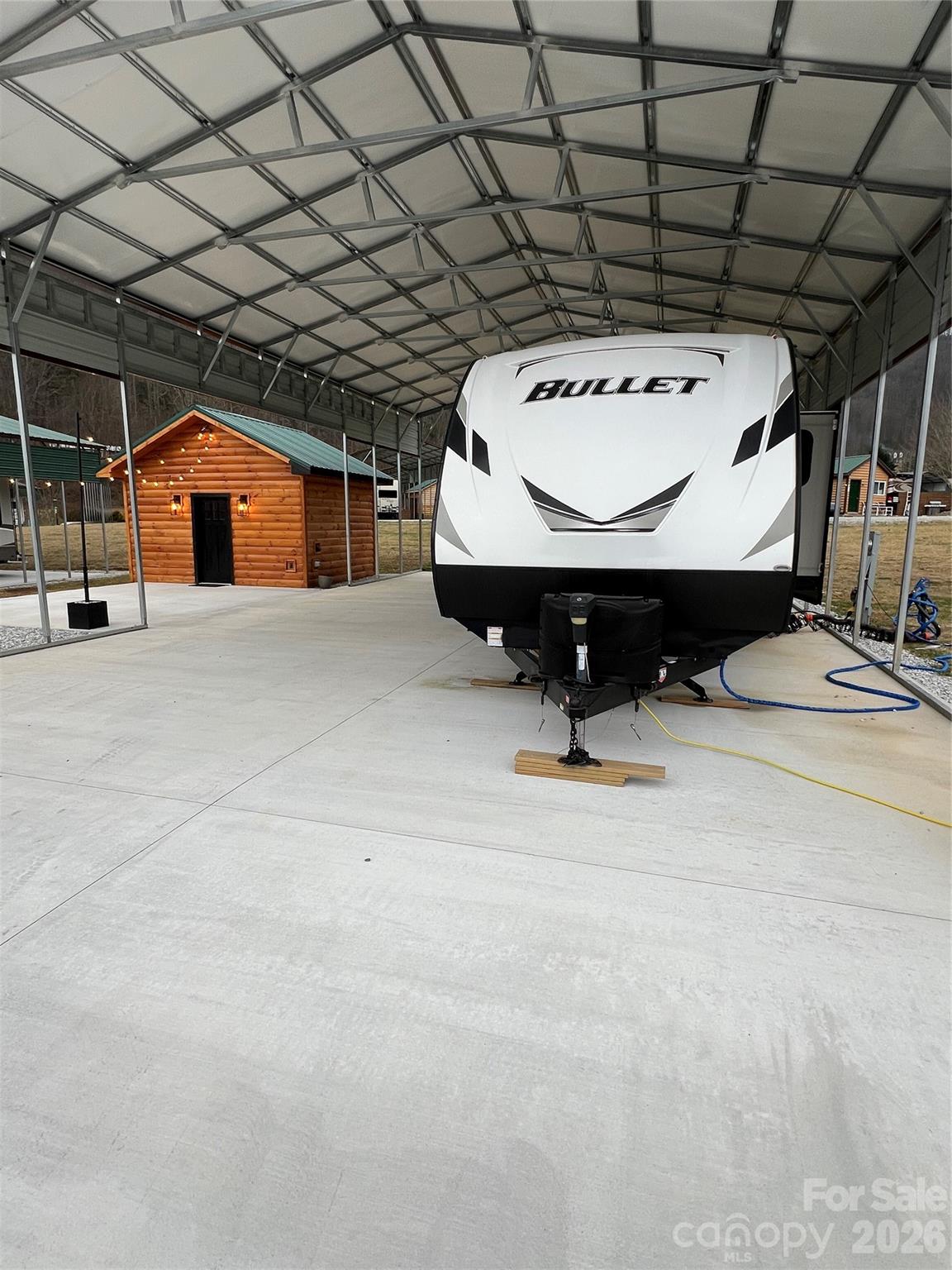 415 Hyde Road, Unit 24 Robbinsville, NC 28771 - Photo 5 of 47 a view of garage with furniture