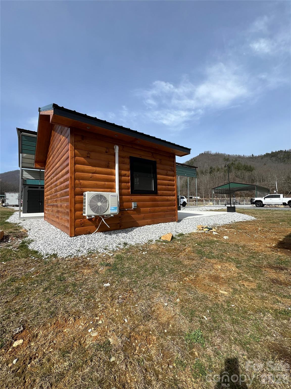 415 Hyde Road, Unit 24 Robbinsville, NC 28771 - Photo 6 of 47 a view of a house with a yard