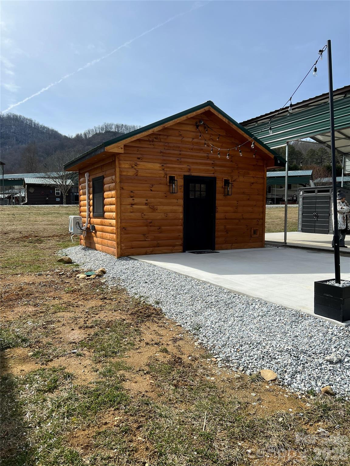 415 Hyde Road, Unit 24 Robbinsville, NC 28771 - Photo 7 of 47 a view of a house with a yard