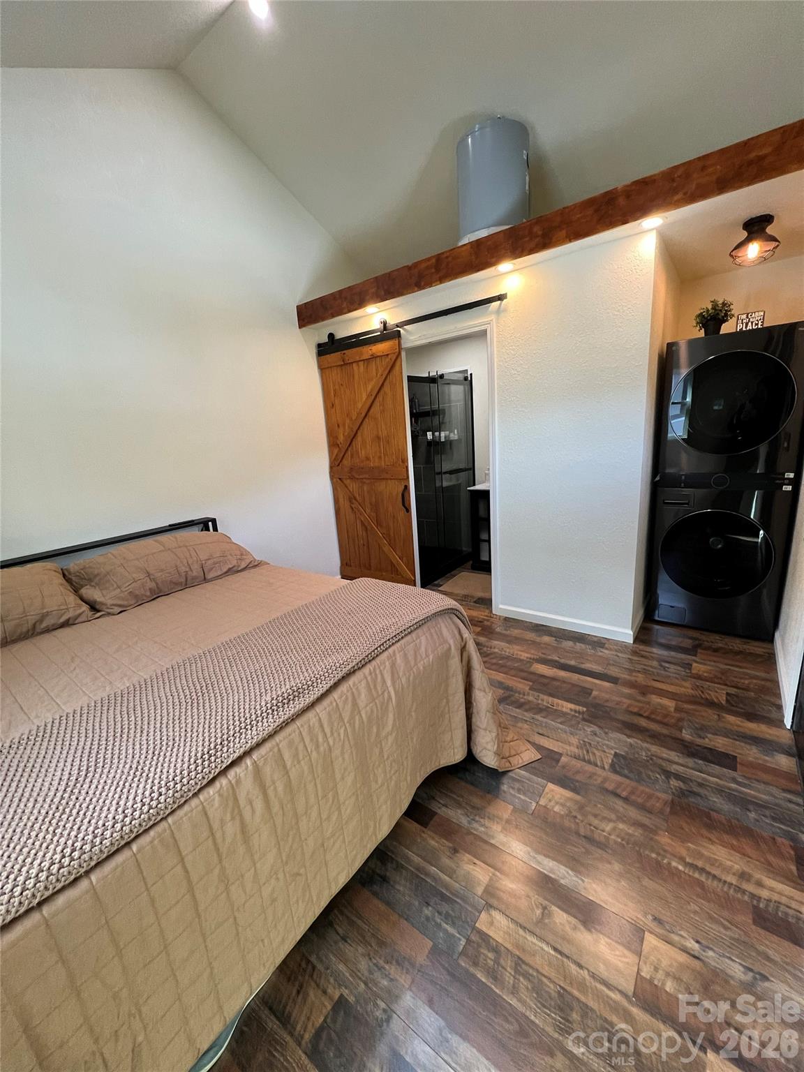 415 Hyde Road, Unit 24 Robbinsville, NC 28771 - Photo 9 of 47 a bedroom with a bed and a walk in closet