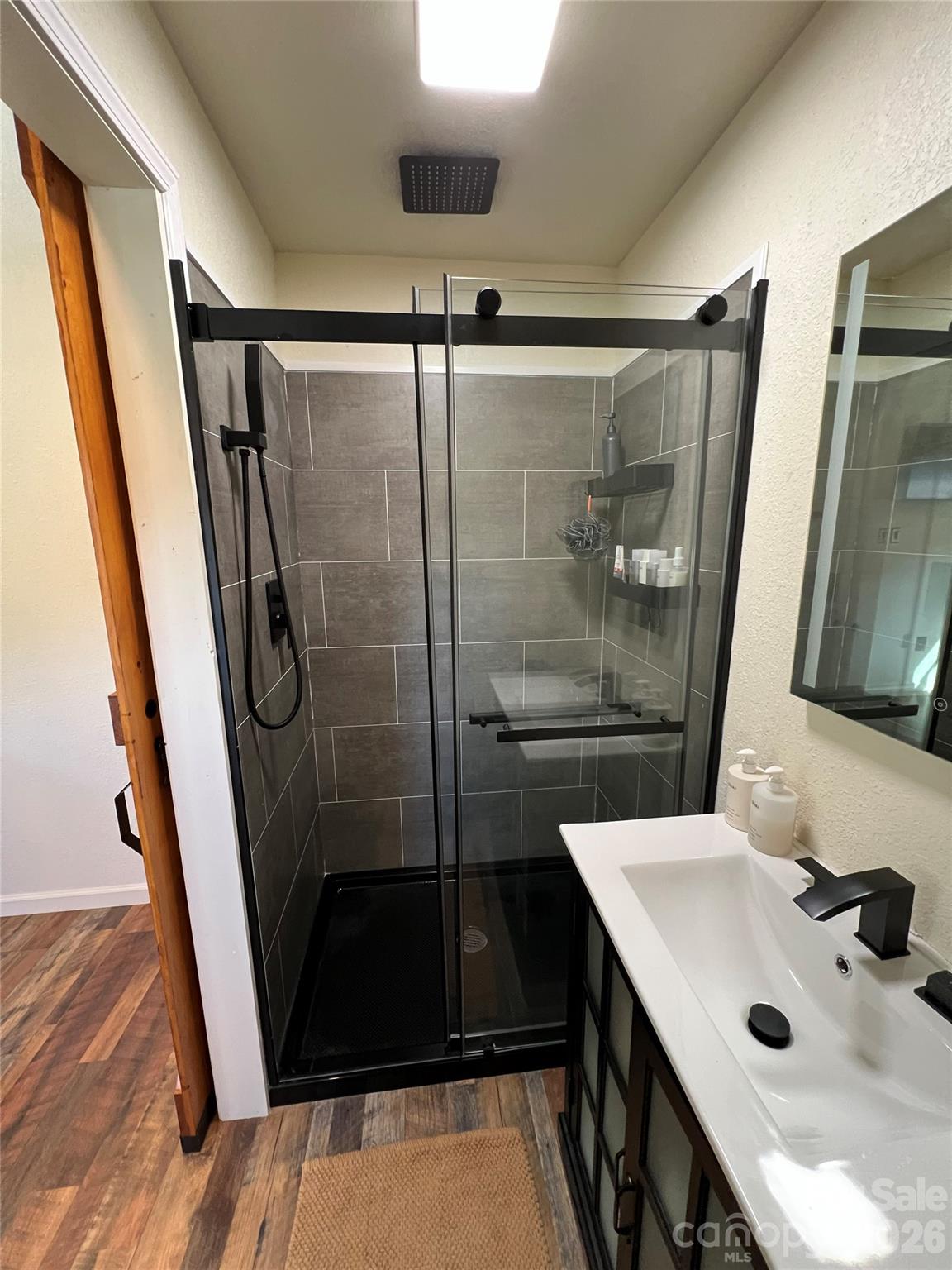 415 Hyde Road, Unit 24 Robbinsville, NC 28771 - Photo 10 of 47 a bathroom with a sink and a mirror