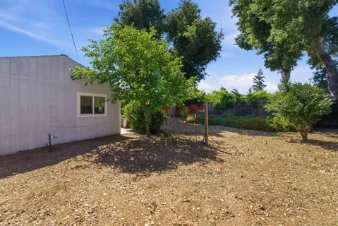 a backyard of a house with lots of green space