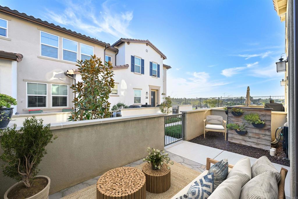 1118 Delpy View Vista, CA 92084 - Photo 2 of 32 a balcony with furniture and a potted plant