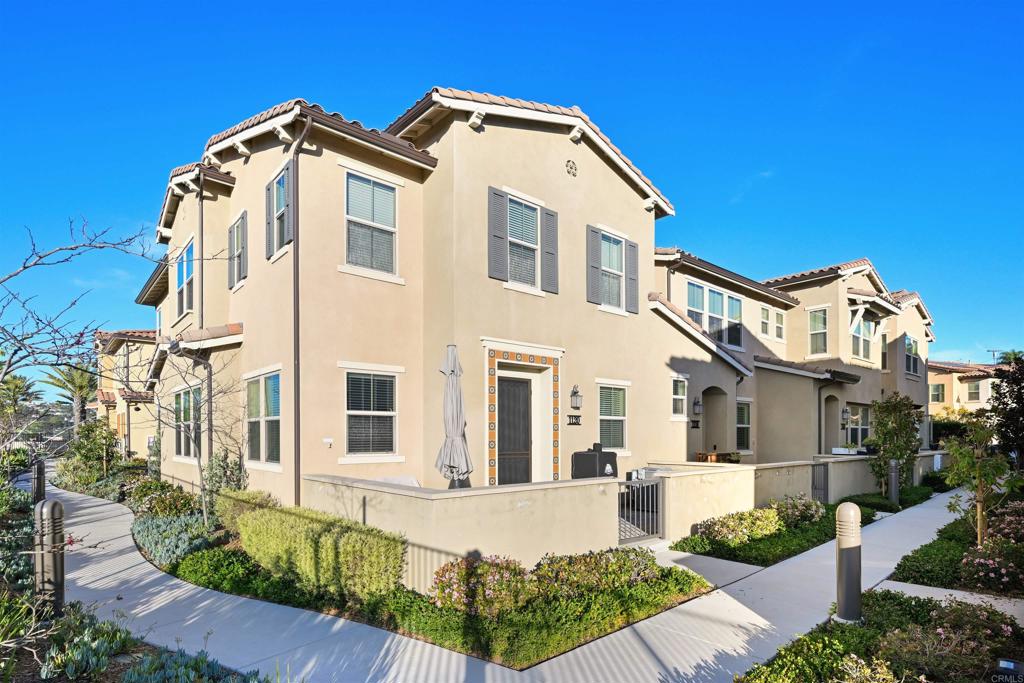 1118 Delpy View Vista, CA 92084 - Photo 26 of 32 a front view of a house with a yard