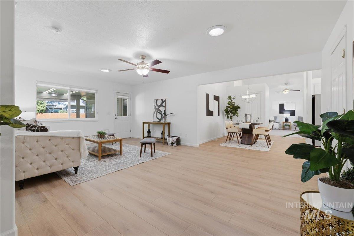 2075 North Springland Place Boise, ID 83713 - Photo 16 of 49 Spacious living area featuring light wood-finish flooring, recessed lighting, and a ceiling fan