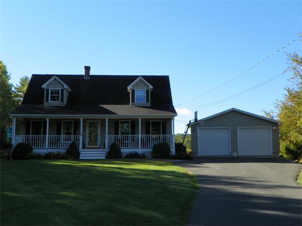 287 Wales Road Monson, MA 01057 - Photo 2 of 30 a front view of a house with a garden and yard