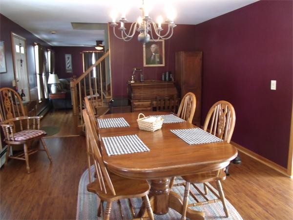 287 Wales Road Monson, MA 01057 - Photo 8 of 30 a view of a dining room with furniture and wooden floor