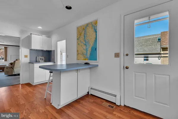 a kitchen with stainless steel appliances granite countertop a sink and wooden cabinets