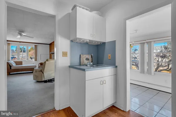 a room with window and cabinet