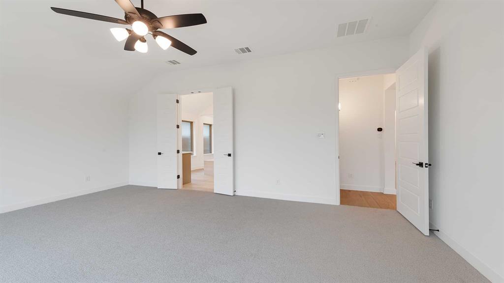 829 Stoney Bridge Way Lavon, TX 75166 - Photo 14 of 35 a view of empty room with ceiling fan