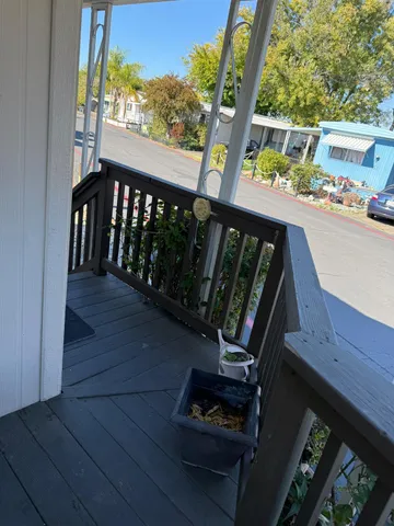 a view of a chairs and table in patio