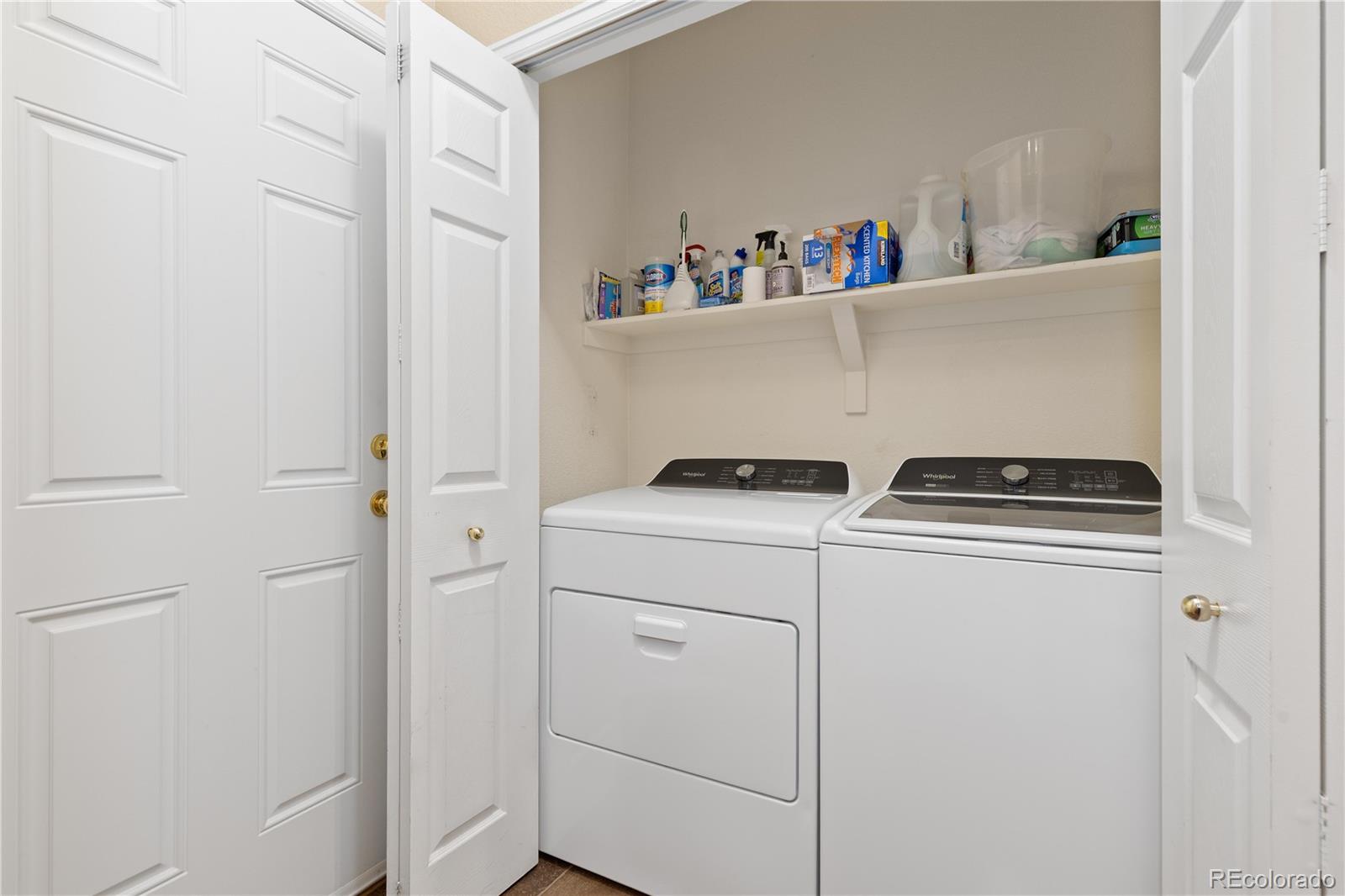 1468 Thunder Butte Road Castle Rock, CO 80109 - Photo 15 of 33 a utility room with dryer and washer