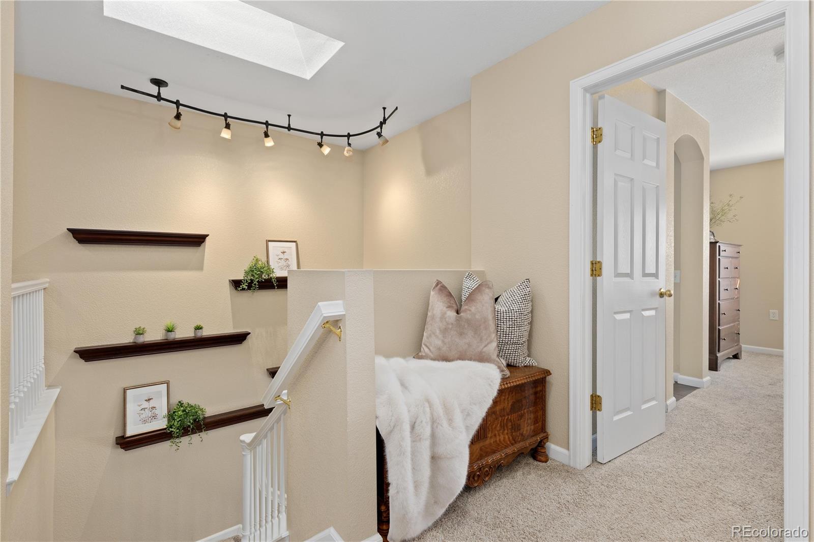 1468 Thunder Butte Road Castle Rock, CO 80109 - Photo 16 of 33 a bedroom with a bed and a ceiling fan