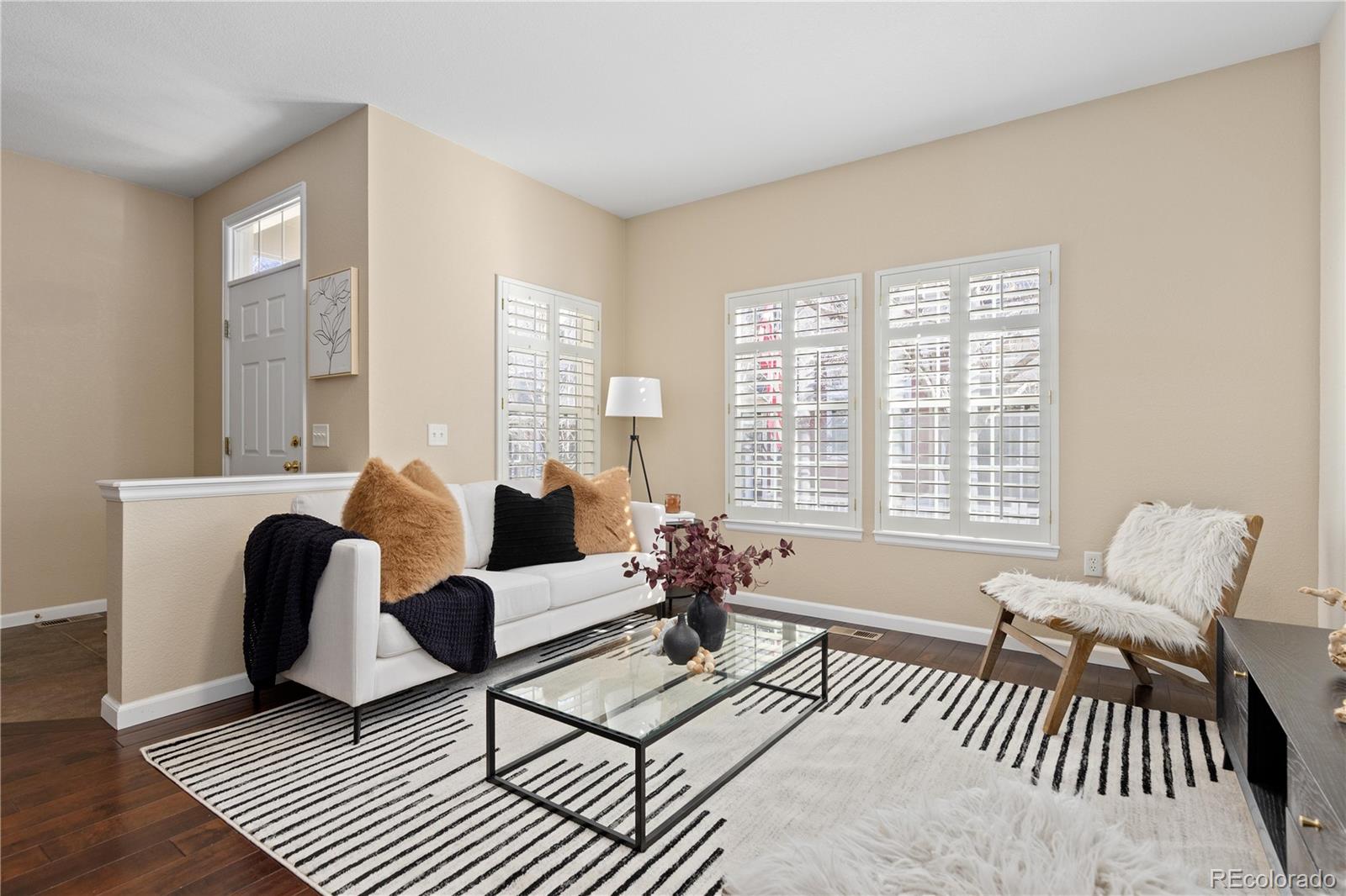 1468 Thunder Butte Road Castle Rock, CO 80109 - Photo 2 of 33 a living room with furniture and a large window
