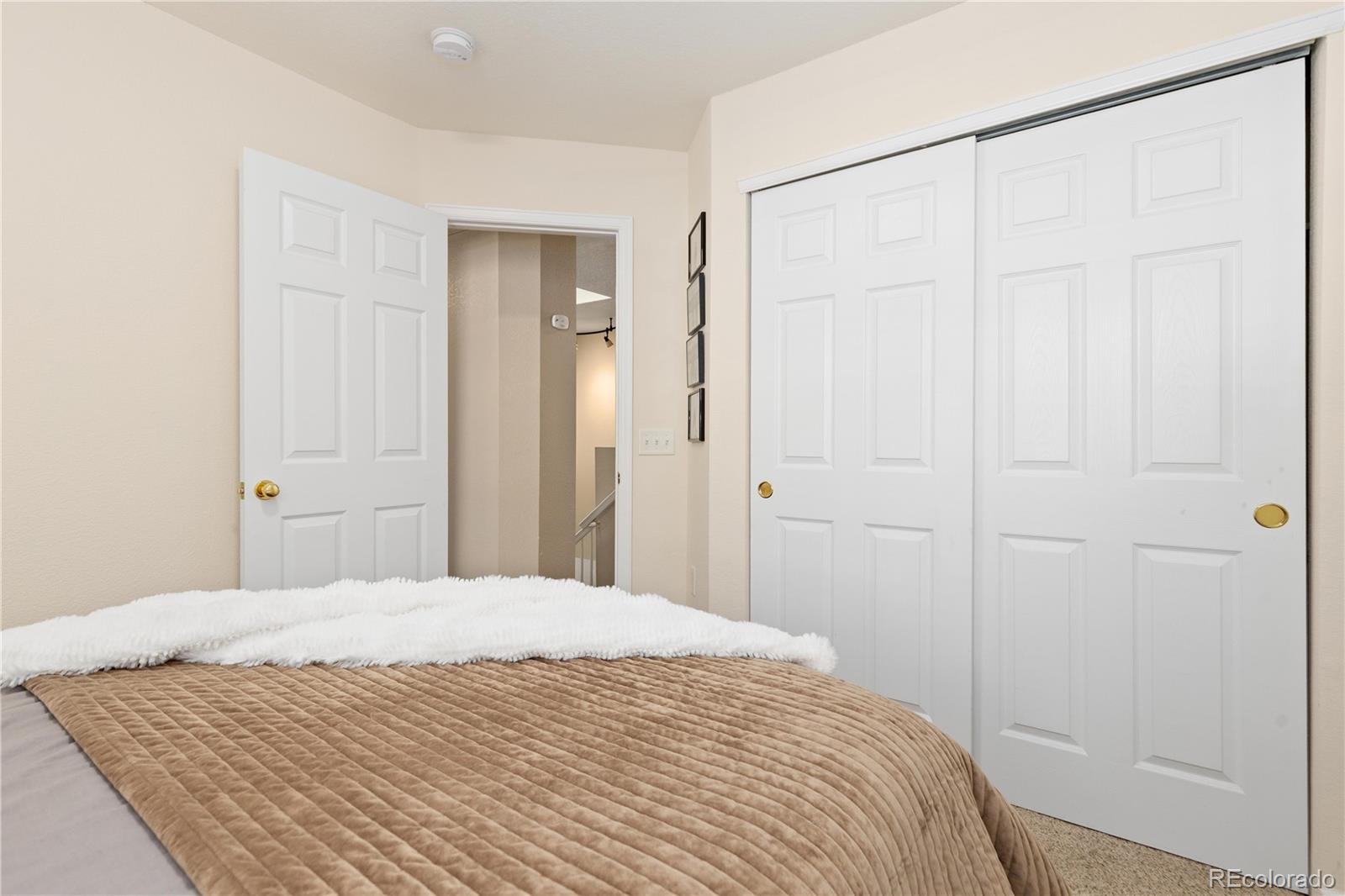 1468 Thunder Butte Road Castle Rock, CO 80109 - Photo 23 of 33 a bedroom with a bed and a shower