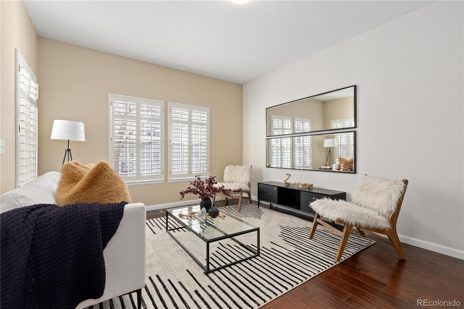 1468 Thunder Butte Road Castle Rock, CO 80109 - Photo 3 of 33 a living room with furniture and two large window