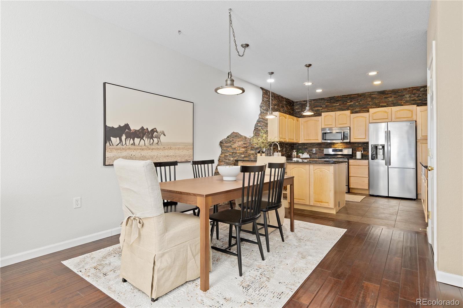 1468 Thunder Butte Road Castle Rock, CO 80109 - Photo 7 of 33 a view of a dining room with furniture