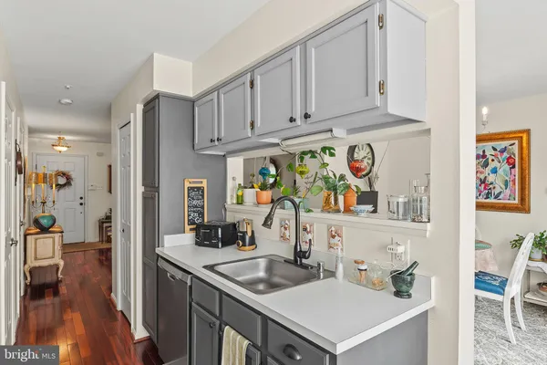 a view of kitchen island with furniture and wooden floor