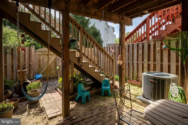a view of an chairs and potted plants