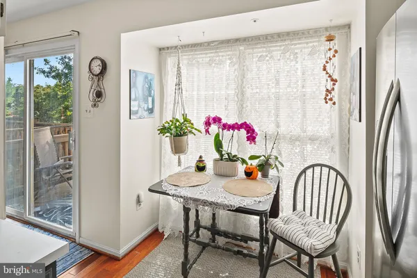 a view of a dining room with furniture window and wooden floor