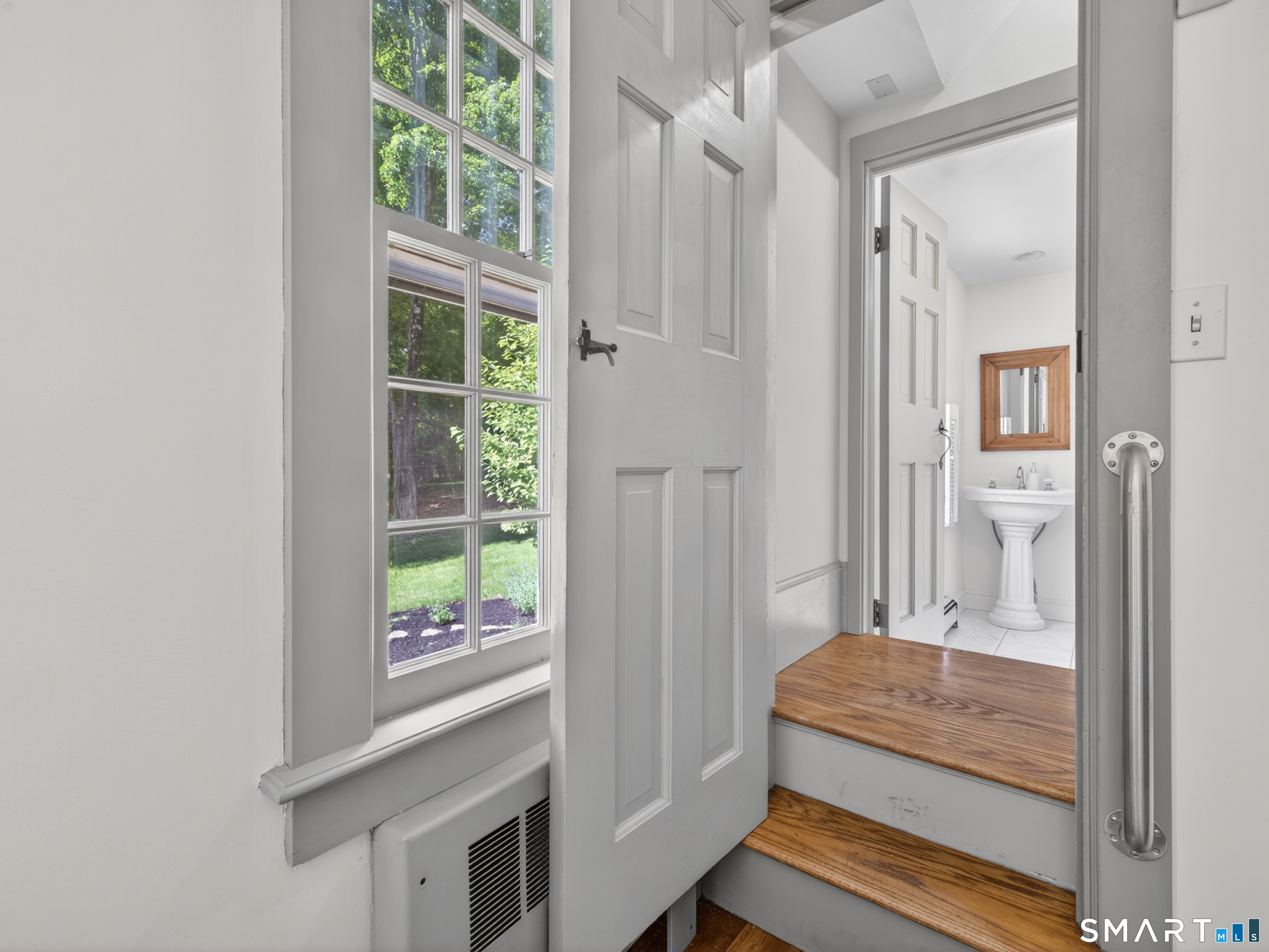 14 Cow Pen Hill Road Killingworth, CT 06419 - Photo 17 of 40 Just beyond the family room, you will find a thoughtfully placed half bath and laundry area, providing convenience without disrupting the flow
