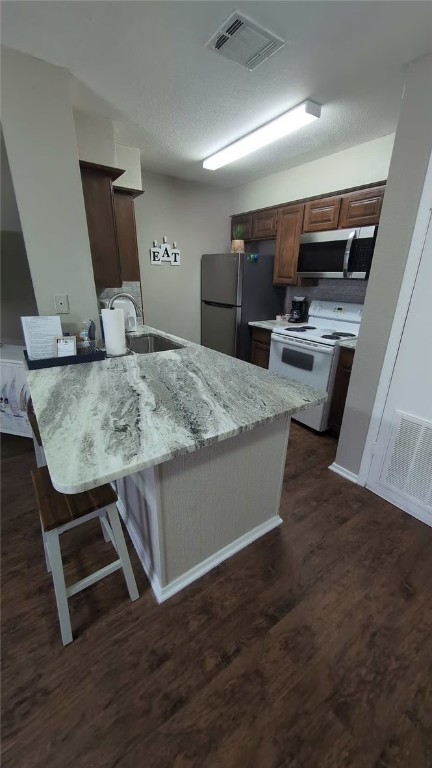 1305 West Villa Maria Road, Unit F104 Bryan, TX 77801 - Photo 5 of 9 a room with wooden floor and furniture