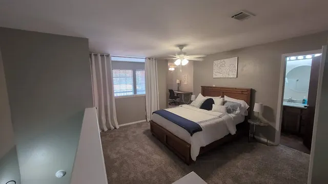 a bed room with a bed and a window