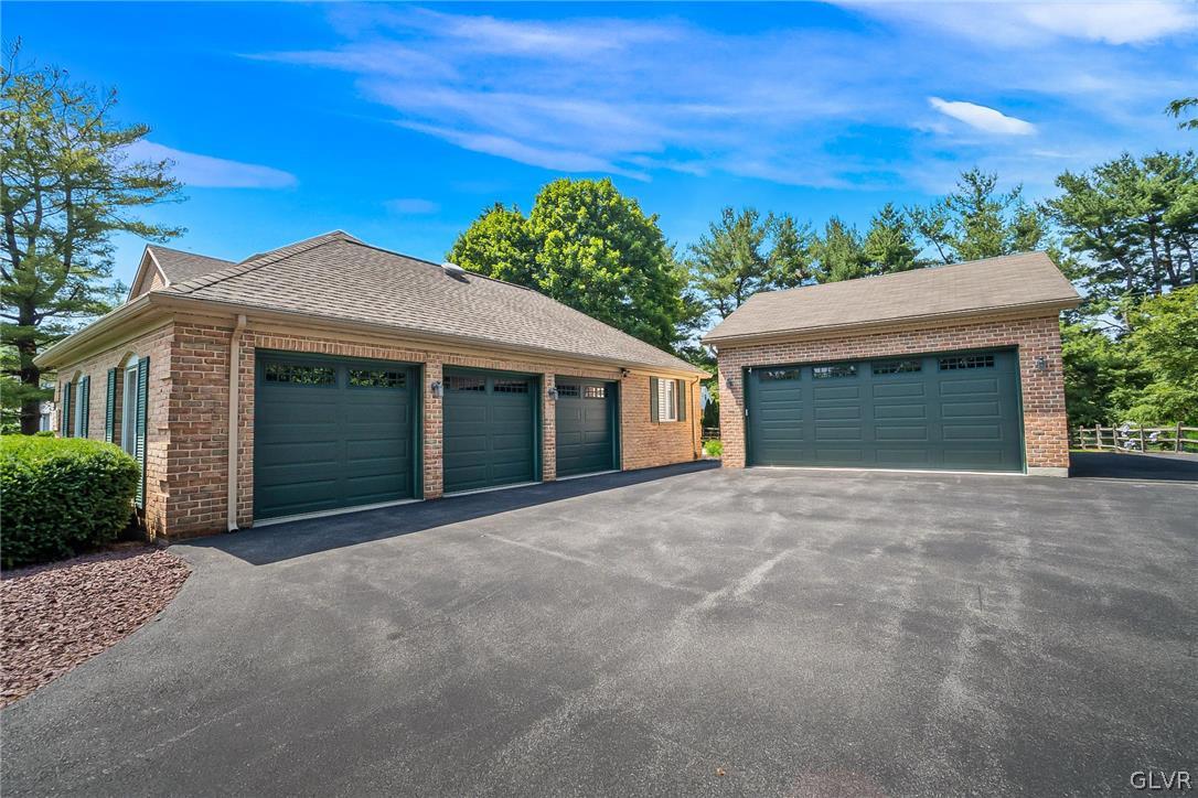 640 Macada Road Bethlehem, PA 18017 - Photo 2 of 48 a front view of a house with a yard and garage
