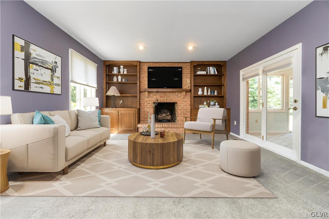 640 Macada Road Bethlehem, PA 18017 - Photo 22 of 48 a living room with furniture a flat screen tv and a fireplace