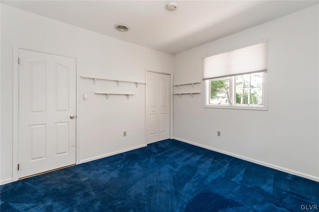 640 Macada Road Bethlehem, PA 18017 - Photo 25 of 48 an empty room with wooden floor and windows