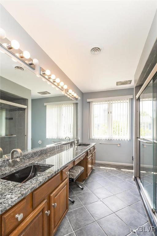 640 Macada Road Bethlehem, PA 18017 - Photo 39 of 48 a spacious bathroom with a granite countertop tub and a large mirror