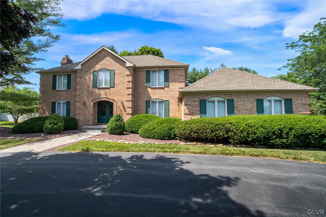 640 Macada Road Bethlehem, PA 18017 - Photo 42 of 48 a front view of a house with a yard and garage