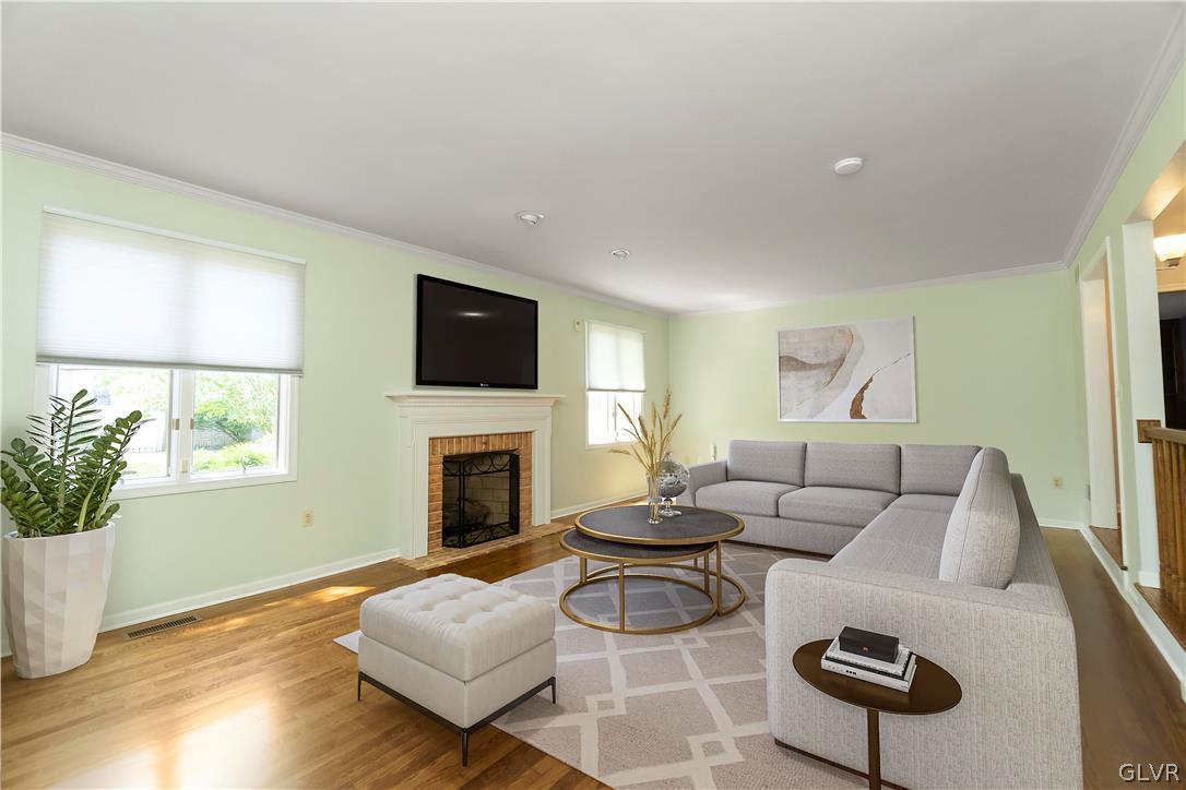 640 Macada Road Bethlehem, PA 18017 - Photo 7 of 48 a living room with furniture flat screen tv and a fireplace