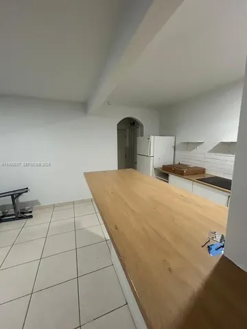 a bedroom with a bed and a stove