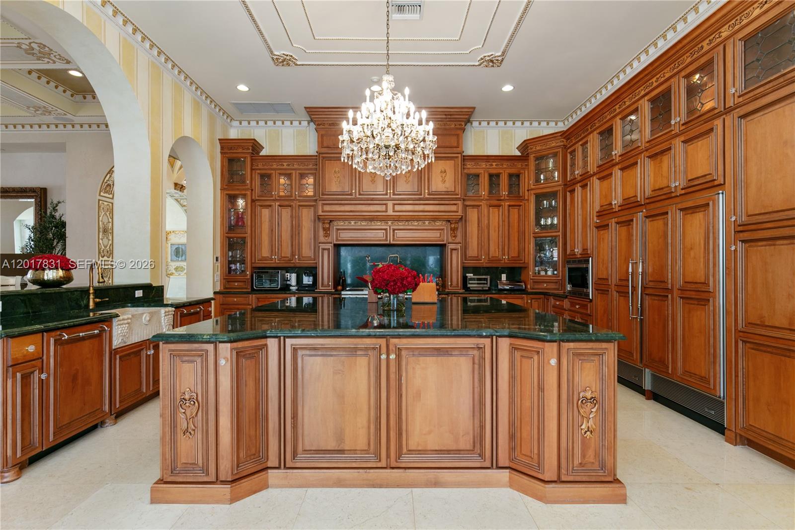 2951 Lake Ridge Lane Weston, FL 33332 - Photo 18 of 64 a kitchen with stainless steel appliances granite countertop a sink dishwasher a dining table and chairs with wooden floor