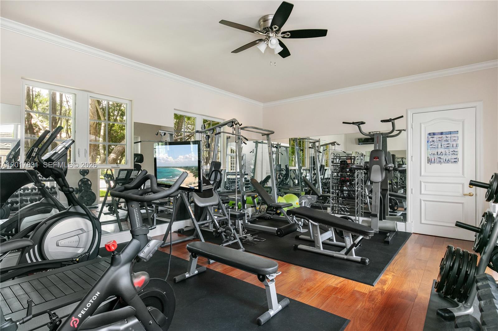 2951 Lake Ridge Lane Weston, FL 33332 - Photo 26 of 64 a room with gym equipment and a large window