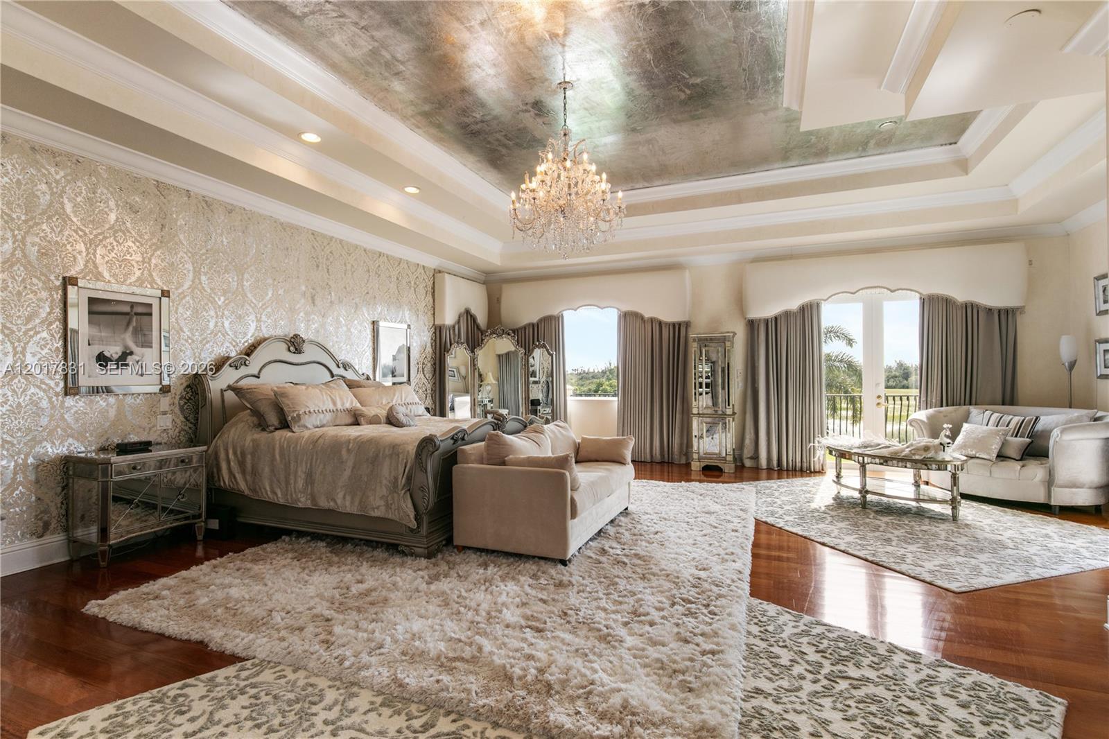 2951 Lake Ridge Lane Weston, FL 33332 - Photo 30 of 64 a living room with furniture and a chandelier