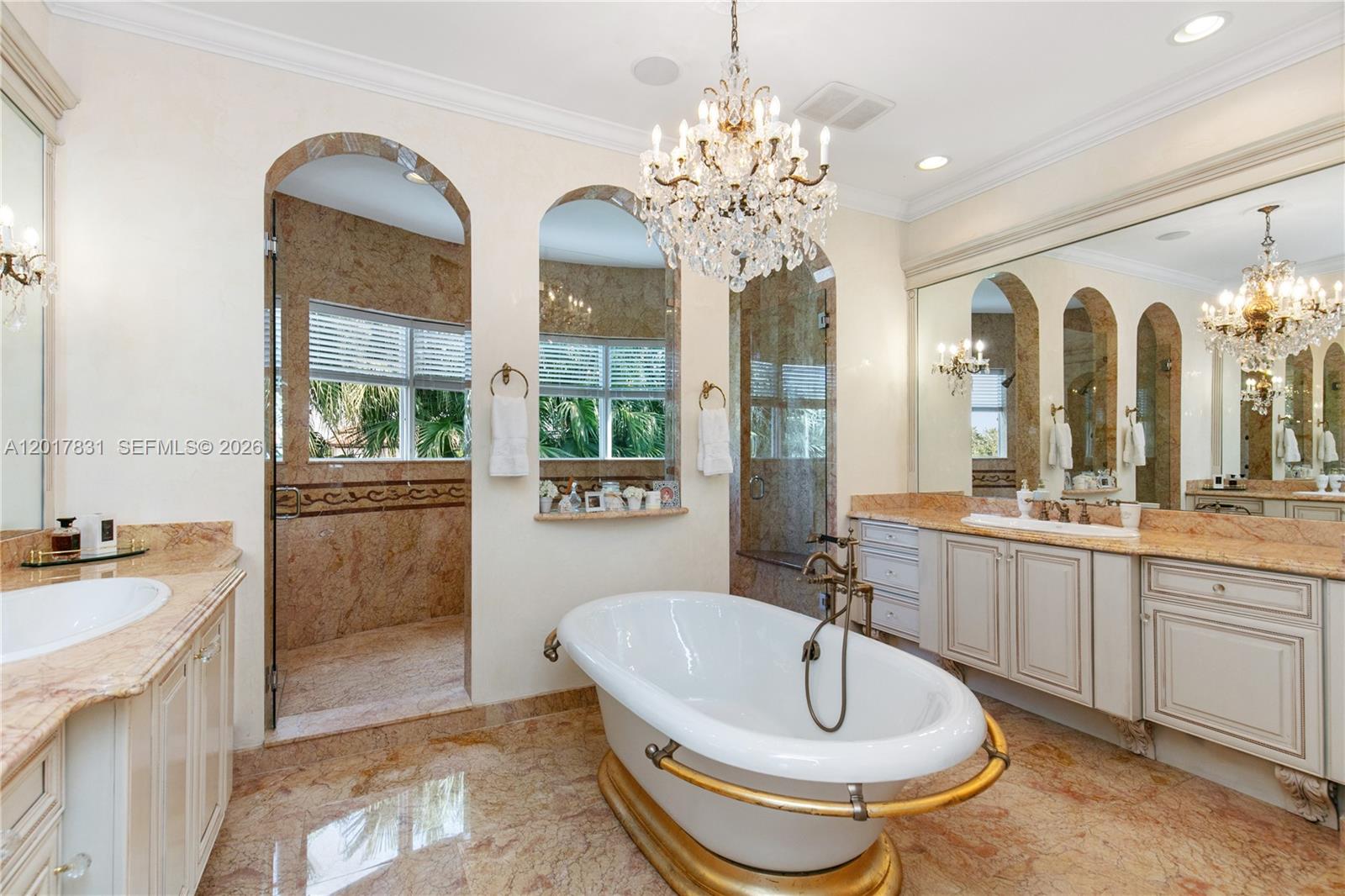 2951 Lake Ridge Lane Weston, FL 33332 - Photo 34 of 64 a spacious bathroom with a sink a large mirror and a bathtub