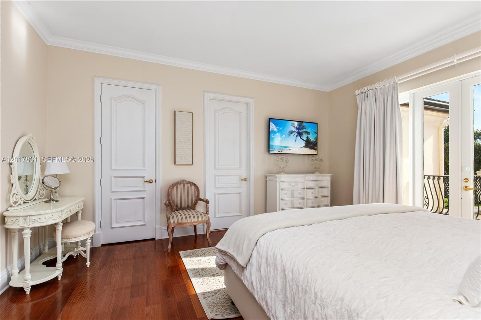 2951 Lake Ridge Lane Weston, FL 33332 - Photo 36 of 64 a bedroom with a bed and a table in it