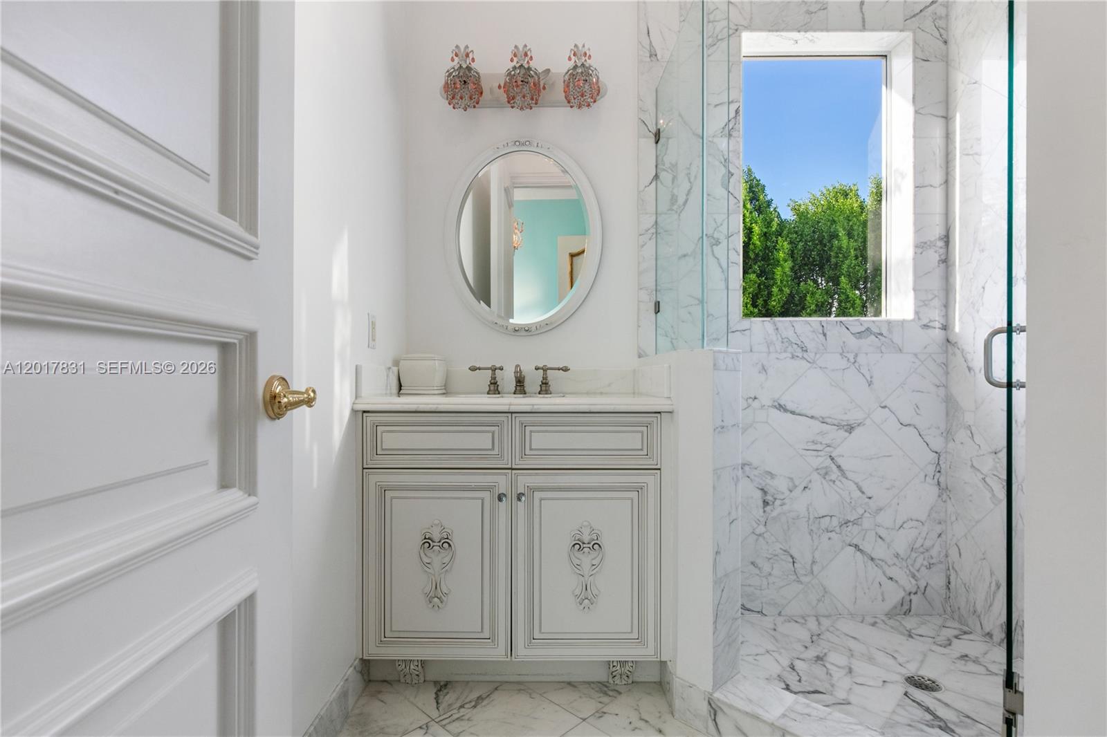 2951 Lake Ridge Lane Weston, FL 33332 - Photo 39 of 64 a bathroom with a sink a vanity and a mirror